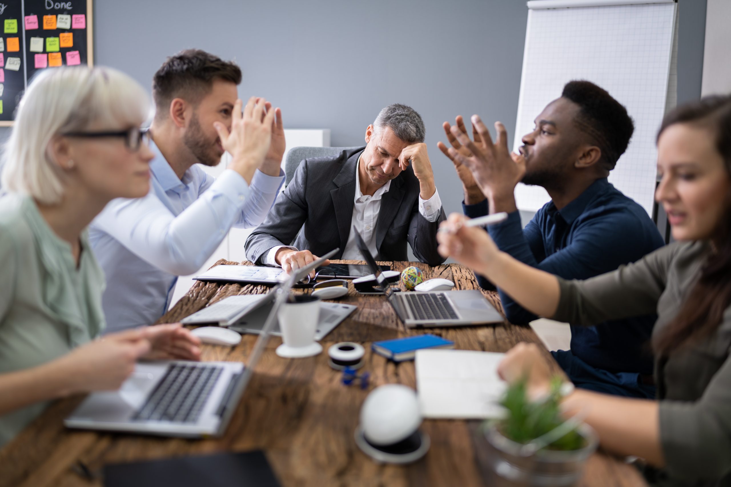 business people arguing in meeting