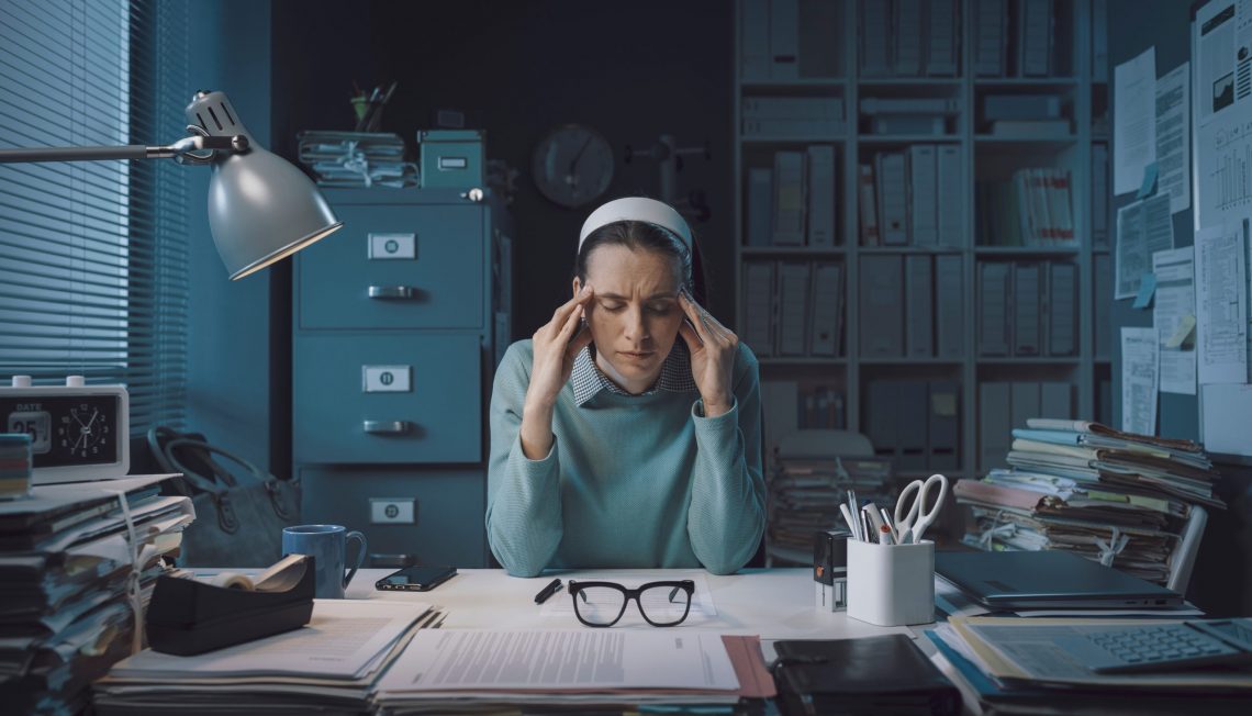 stressed businesswoman with headache