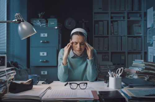 stressed businesswoman with headache