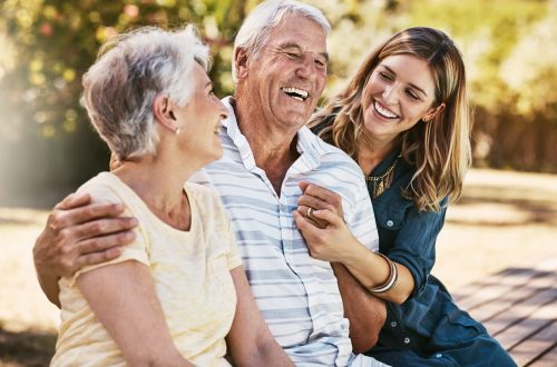 woman, grandparents and hug for family summer vacation, holiday or break together in the outdoors. happy grandma, grandpa and daughter with smile in joyful happiness, love or care for elderly parents