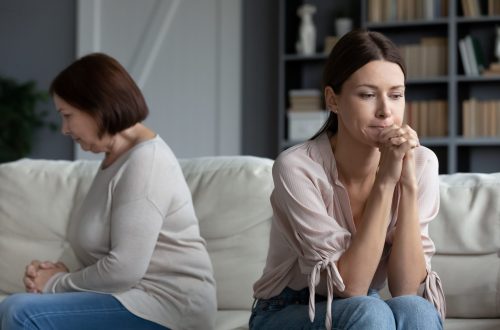 Walking Patiently with Unbelieving Family after quarrel silent daughter sitting aside of middle aged mother