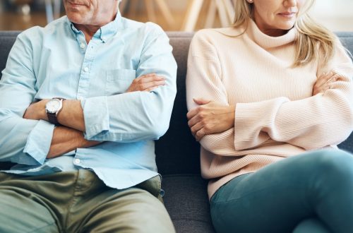 divorce, fail and couple fight due to marriage problem, angry at home about family law and with conflict in a lounge. anger, sad and people or partner frustrated due to infertility on a sofa