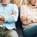 divorce, fail and couple fight due to marriage problem, angry at home about family law and with conflict in a lounge. anger, sad and people or partner frustrated due to infertility on a sofa
