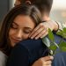 serene affection displayed between a couple with a red rose signifying love and tenderness