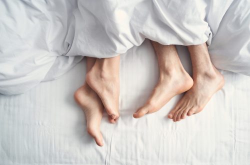 female and a man under the blanket